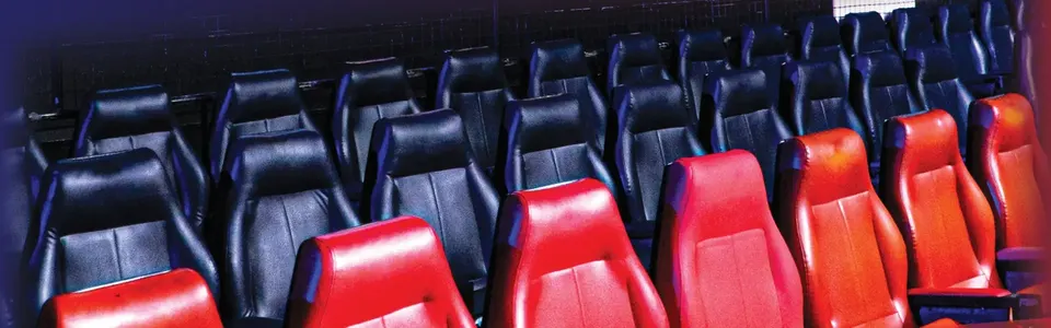 Rows of red and black armchairs at the stadium